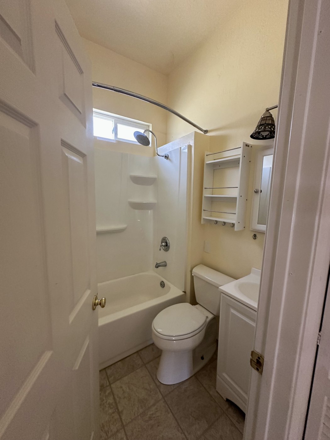 The original bathroom, with a fiberglass tub surround