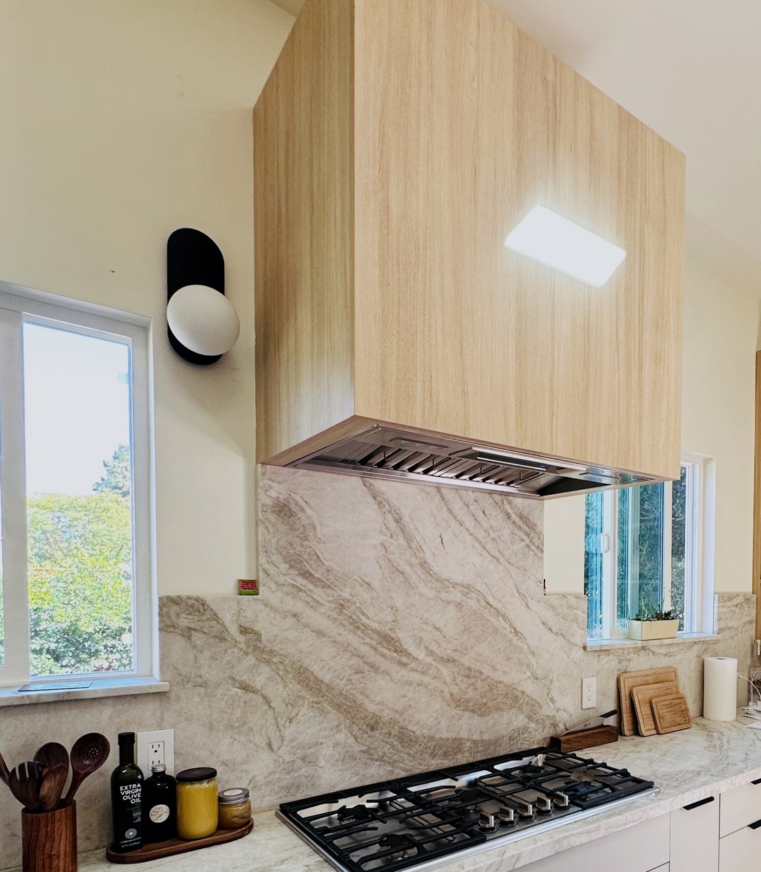 Oak hood and quartzite backsplash