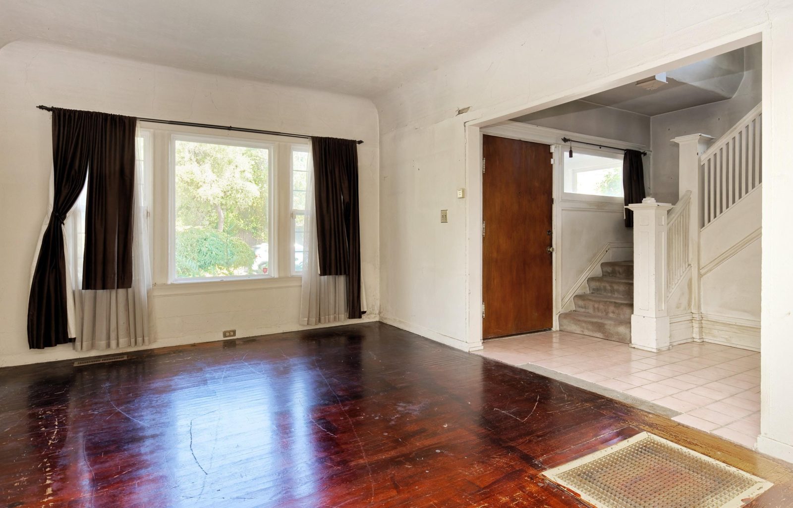 The original front rooms with dark floors