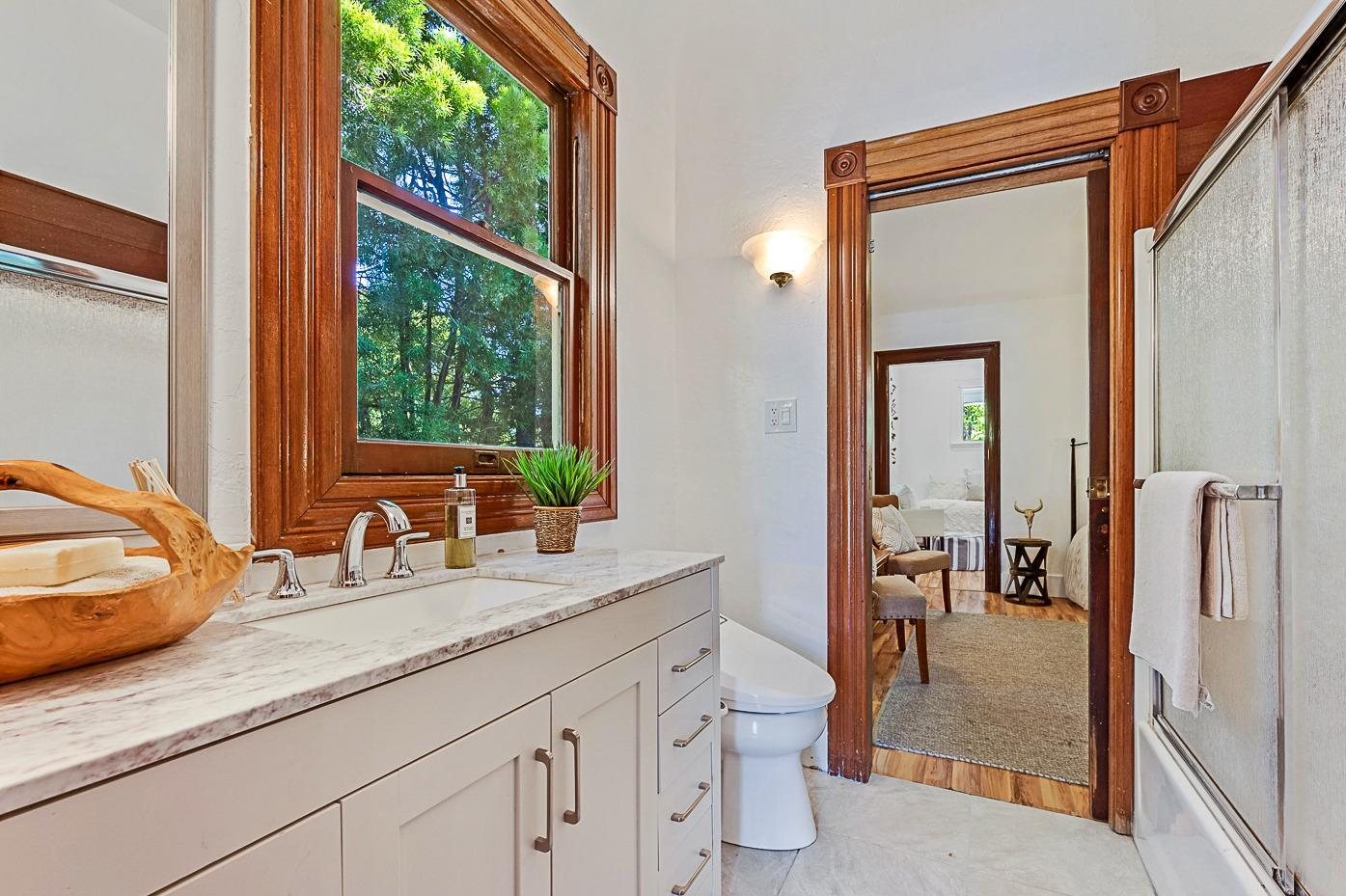 The upstairs bath before, with a tub-shower