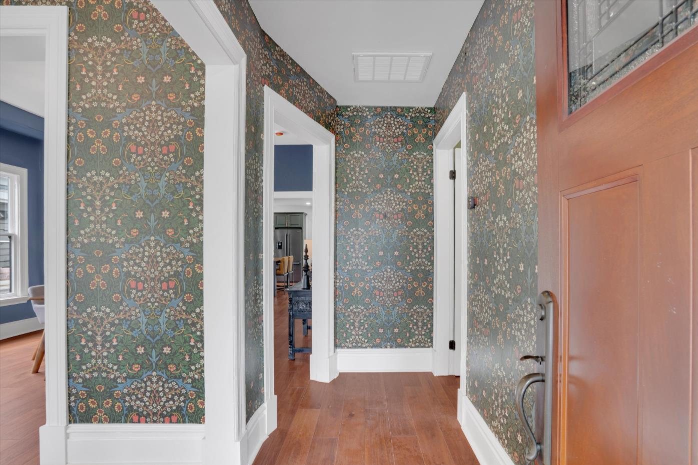 The wallpapered entry hall