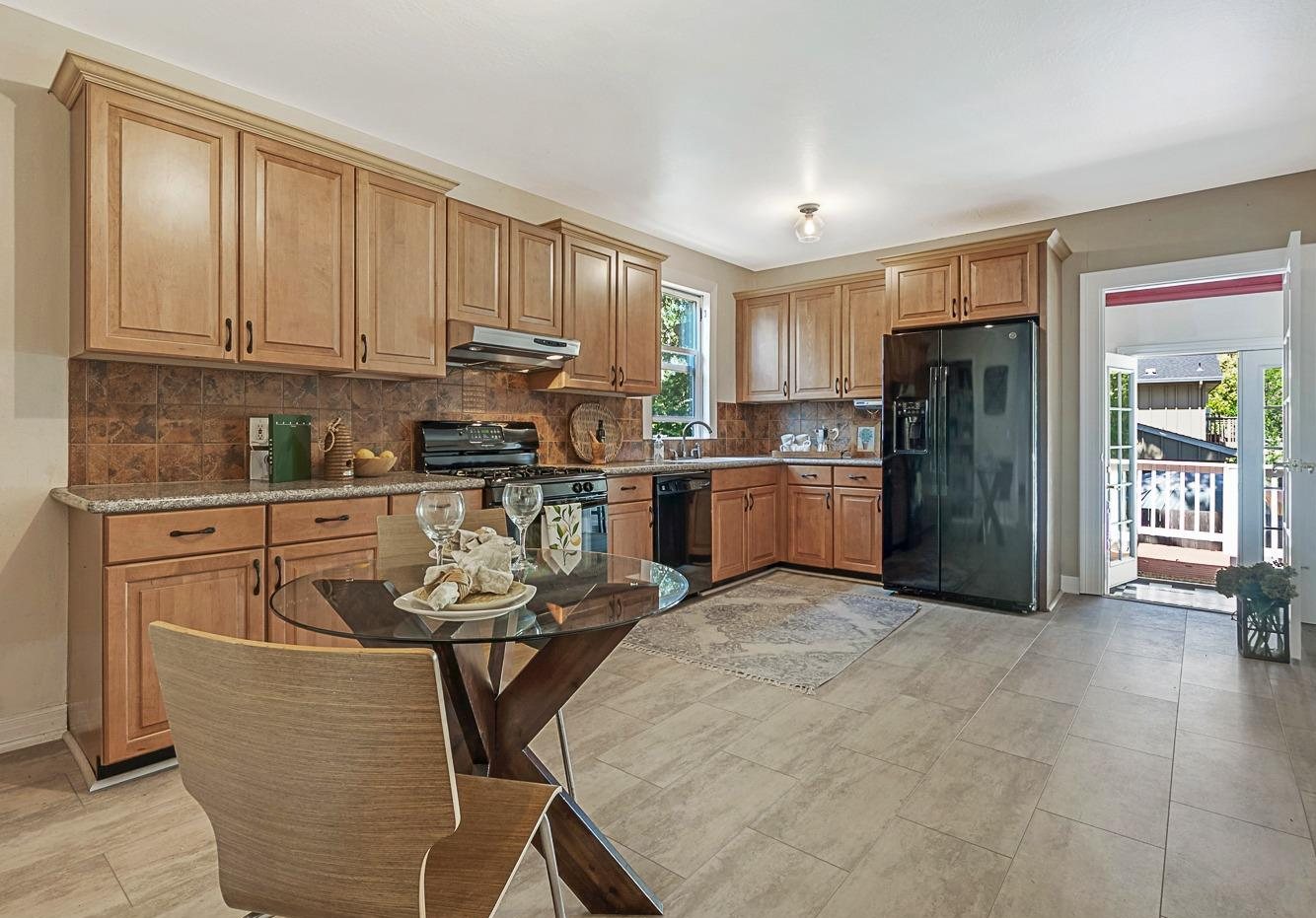 The kitchen before, with maple cabinets