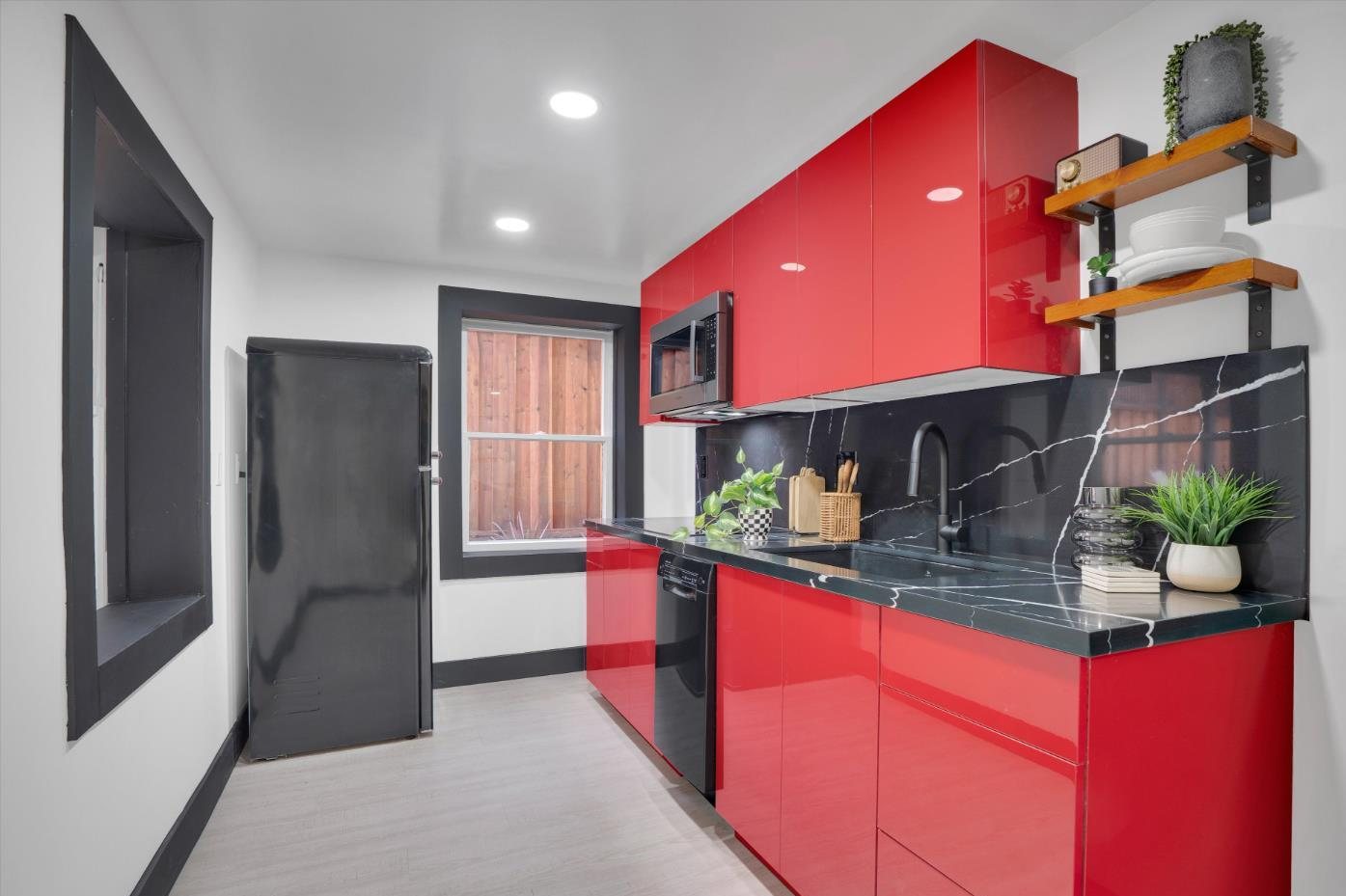 The lower-level kitchen in red lacquer